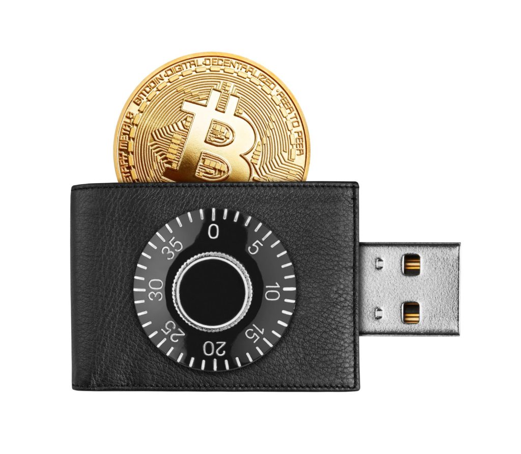 A digital bitcoin wallet with a USB connector and code lock, symbolizing secure cryptocurrency storage and access.